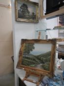 2 oil on canvas of rural scenes & an easel