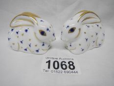 A pair of Royal Crown Derby rabbit paperweights