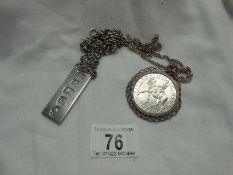 A silver ingot with silver chain & a 1977 Silver Jubilee crown in silver mount with chain 70 gms