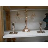 A silver plated candelabara with droppers & a pair of candlesticks