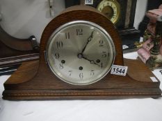 An oak mantel clock