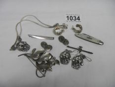 A silver brooch,