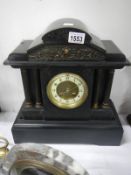 A black slate Paladian 4 pillar mantel clock