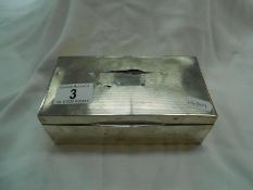 A silver cased cigarette box,