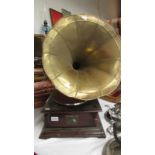 A reproduction HMV His Masters Voice horn gramaphone with brass horn