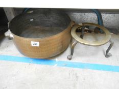 A copper 2 handled saucepan & brass trivet