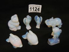 A collection of glass/stone animals and 2 angels