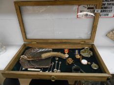 A cased display case including Masonic medals,