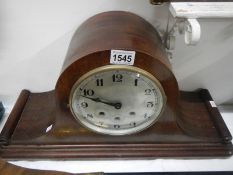 A large mahogany mantel clock