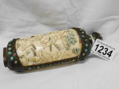 An antique carved ivory and bronze Chinese scent bottle depicting battle scenes, approx. height 16.