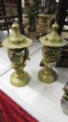 Pair of brass candle lamps