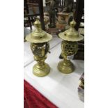 Pair of brass candle lamps