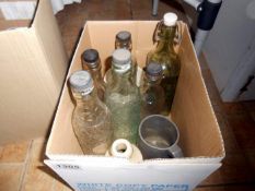 A box of old bottles and stoneware