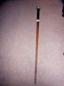 A snooker cue converted to a walking stick