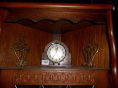 A wood framed clock & 2 brass items