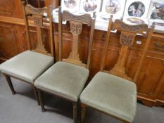 3 carved oak dining chairs