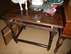 A period oak table (missing drawer)