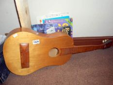 A guitar body and music books