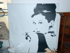 A large canvas print of Audrey Hepbun