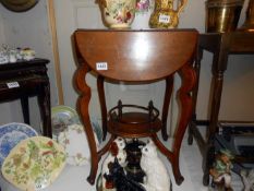 An Edwardian 4 fold table with under gallery