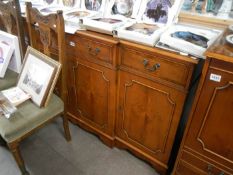 A 4 door mahogany brake front sideboard