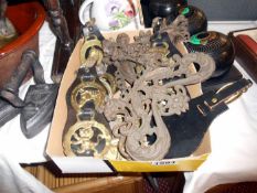 A quantity of horse brasses and cast metal frames etc