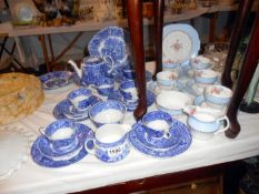 A blue and white tea set and 1 other part set