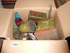 A box of old tins and oils cans including Castrol