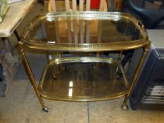 A 2 tier glass topped tea trolley