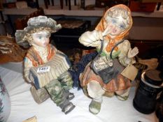 A pair of porcelain child figures