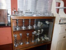 A large quantity of metalware including candlesticks