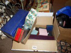 A collection of tins and jewellery boxes