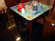 A dominoes table with ashtray inserts