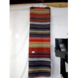 A hand woven wall hanging