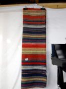 A hand woven wall hanging