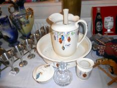 A jug and basin set decorated with Chinese lanterns and other items