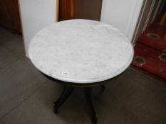 A marble top round table