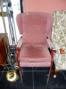 A pink wingback armchair