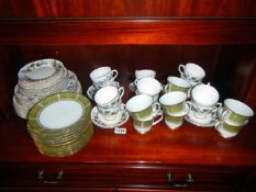 A quantity of Royal Sutherland teacups, saucers & plates