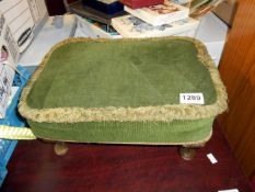 A fabric covered foot stool