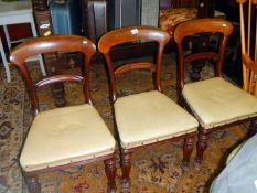 3 wooden chairs with leather seats