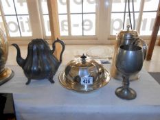 A metal teapot, goblet, milk jug etc