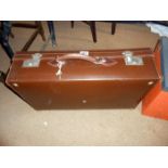 A brown vintage suitcase in excellent order