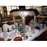 A round silver coloured glass topped table