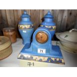 A ceramic clock garniture