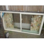 A large white wood glass doored cupboard