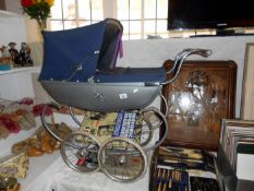 A Silver Cross dolls pram