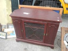 A corner cupboard and other furniture