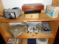 A collection of projectors and silde boxes