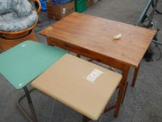 A tiled top table, a folding table and a bed table